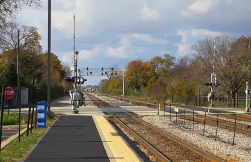 Railroad tracks cut diagonally through the park, dividing it into two distinct sections