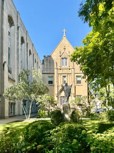 Queen of Angels Catholic Church is visible along Sunnyside Avenue