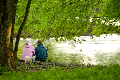 Couple watches White River's flowing waters