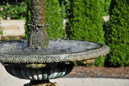 Ornate stone fountain basin with decorative rim
