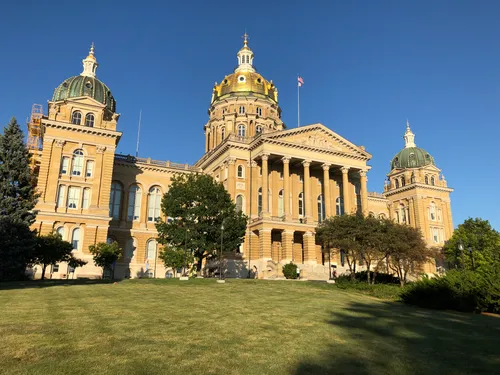 Iowa State Capitol's facade bathed in warm sunlight