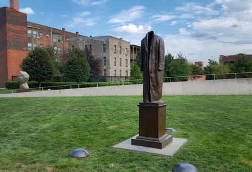 Judith Shea's bronze Post Balzac is presented on the pristine lawn
