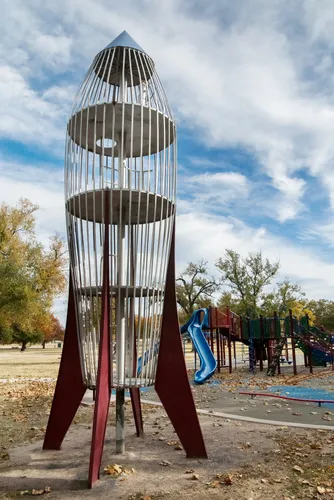 A rocket ship play structure ready for launch into cloudy Kansas skies