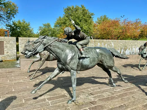 A closeup view of the bronze horse racing sculptures
