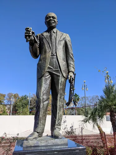 Louis Armstrong statue against blue sky