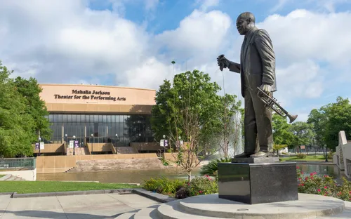 Louis Armstrong in front of the Mahalia Jackson theater