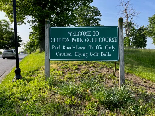 Welcome and caution sign at Clifton Park Golf Course along East 32nd Street