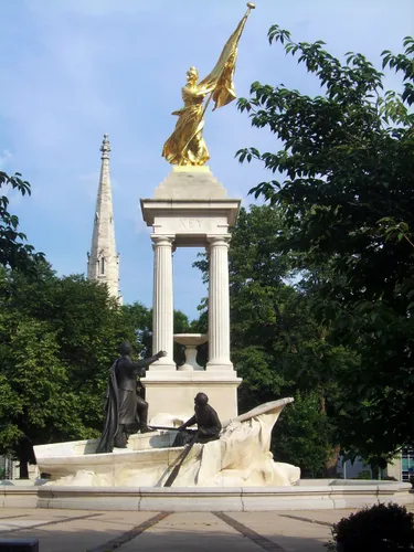 The Francis Scott Key Monument features a gilded Lady Columbia atop four stone columns