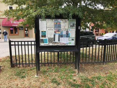 Neighborhood details are displayed on an information kiosk in the park