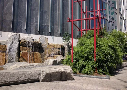 These fountain and rock features suggest a natural waterfall and shallow riverbed