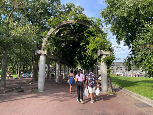 Visitors walk through the park's columned archway