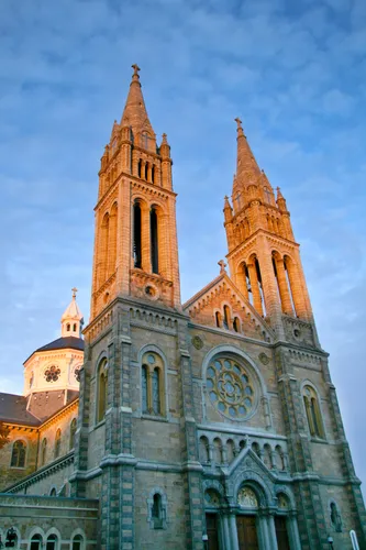 The twin spires of the Basilica of Our Lady of Perpetual Help rise next to the park