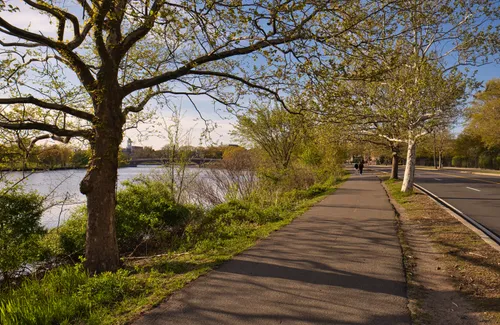 Memorial Drive sidewalk alongside the river in late afternoon light