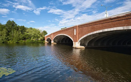 Eliot Bridge spans the Charles River under clear skies
