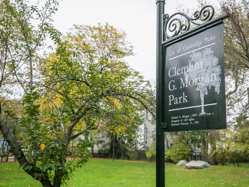 Entrance sign for Clement G. Morgan Park amid autumn foliage