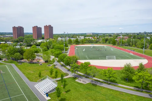 Athletic fields surrounded by greenery