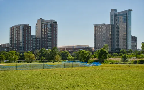 Boston towers and Agganis Arena behind the park landscape