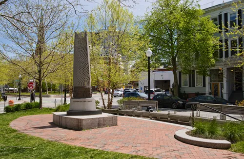 Celebrate the Coast sculpture by David Fichter stands in McElroy Park's brick plaza
