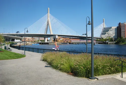 Pathway along the riverfront with Leonard P. Zakim Bunker Hill Memorial Bridge in the background