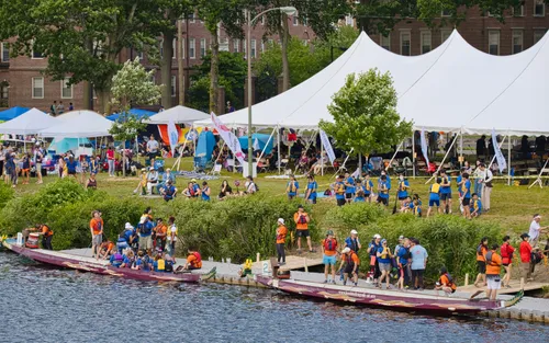 Festive crowd gathering by the water during the Dragon Boat Festival