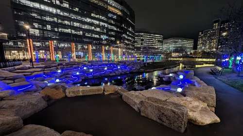 Beautiful nighttime lighting around the park's pond