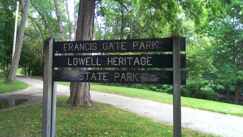 A sign next to the path marks the park location