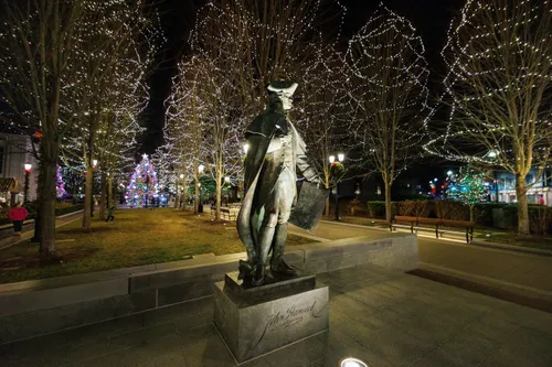 Statue of John Hancock among decorated holiday trees