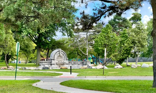 View of the historic Merrill Fountain with the playground visible behind