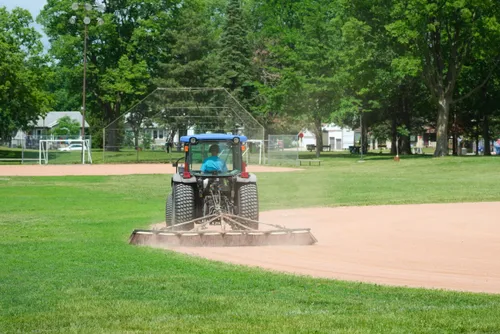 Tractor maintaining the park's baseball fields
