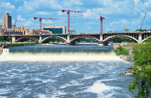 Saint Anthony Falls rushes near the park