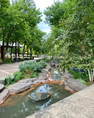 Gentle stream flowing over rocky terrain through the heart of the park
