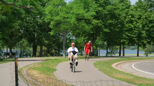 Two men on the paved trail around Lake Phalen