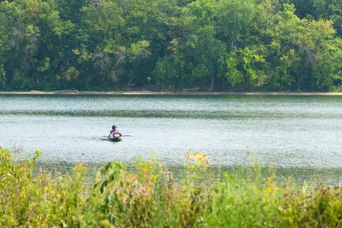 A kayaker explores the lake