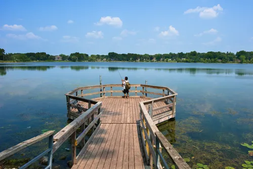 This wooden fishing pier extends into the lake's northwest shore