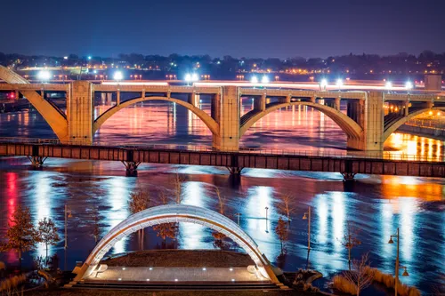 Nighttime view of the island's eastern tip and Robert Street Bridge