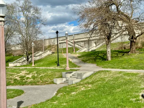 Stone stairways lead visitors through the grassy hillside