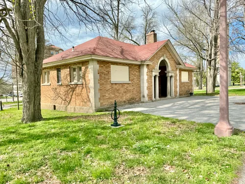 A small brick building in the park's southwest section