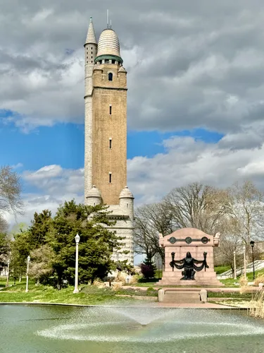 The Naked Truth statue and the water tower seen behind the pond