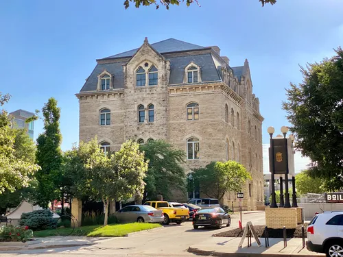 The 1874 Old City Hall building sits behind the park as seen from 10th Street