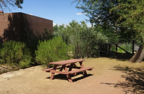 A picnic table offers a place of rest under the Las Vegas sun