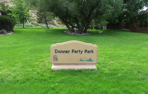 A closer look at the Donner Party Park sign next to Rio Poco Road