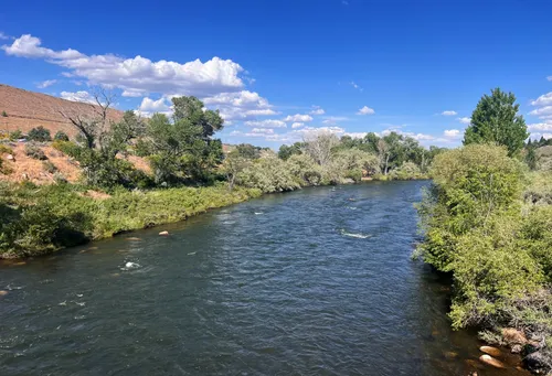 Truckee River flows through the park under clear blue skies