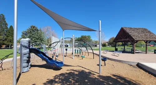 The large playground area features a variety of play structures