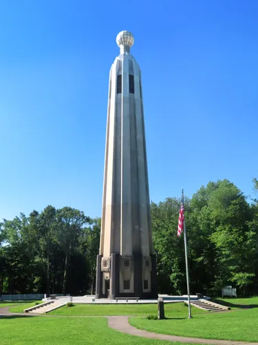 Edison Memorial Tower rises against a clear blue sky