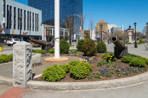 The park's southern tip displays two decorative cannons and a flagpole