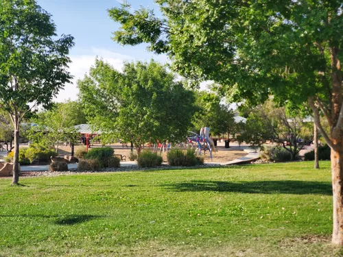 Green open space with playground area behind