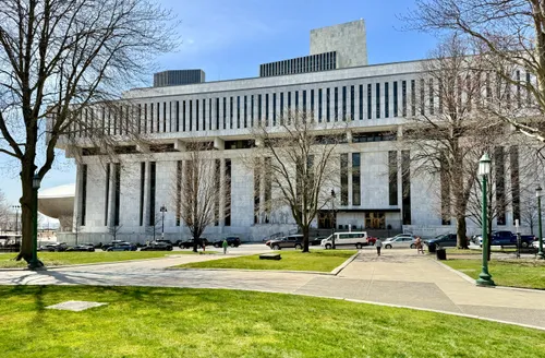 The Legislative Office Building across State Street with its cantilevered marble facade