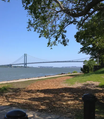 Verrazzano-Narrows Bridge spans the horizon from the waterfront grounds