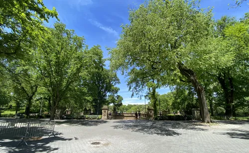 Shady tree canopy creates cooling respite at the entrance to Bethesda Terrace