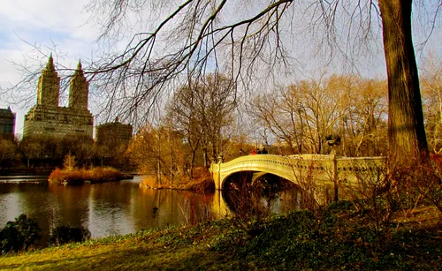 Bow Bridge arches over the lake in late autumn light